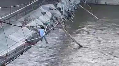 Yıkılma tehlikesi olan köprüye çıkarak canını hiçe saydı